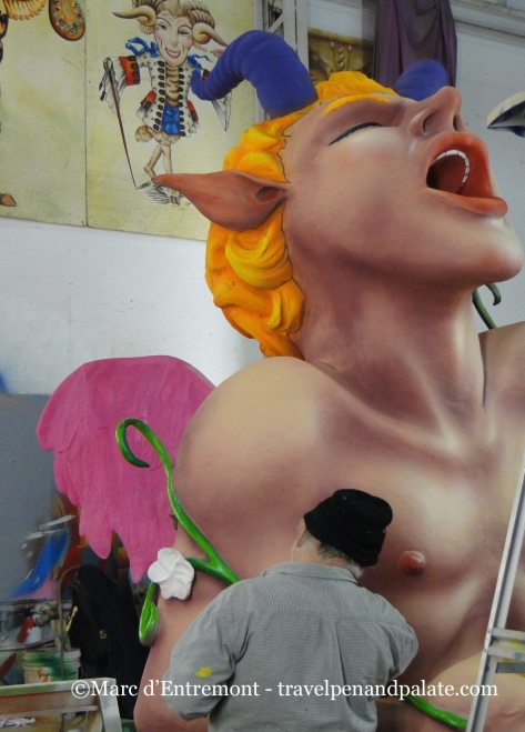 painting a prop at Mardi Gras World, New Orleans
